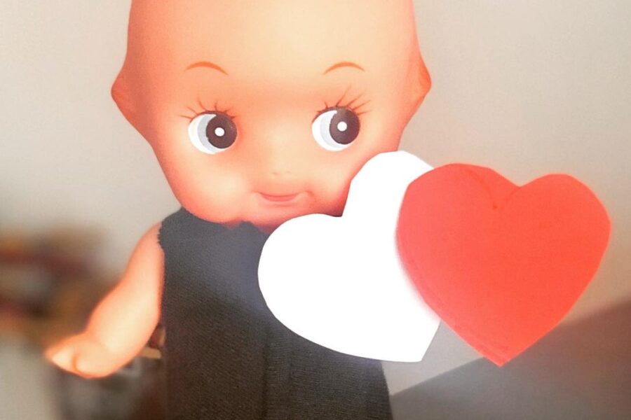 Kewpie with heart shaped papers